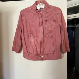 Pink corduroy bomber jacket with 3/4 length sleeves. 