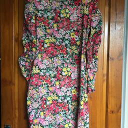 WAREHOUSE FLOWER PATTERN DRESS.SIZE 12.NEW WITH TAGS.SHORT.SLIGHTLY STRETCHY WITH SLIGHT FLARE.ROUNDNECK WITH V BACK.PHOTO 3 IS MORE LIKE TRUE COLOUR OTHERS ARE A LIGHT.