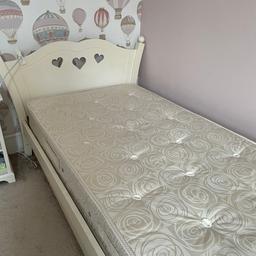 Princess style single bed with mattress and bedside table. Off white. Bed comes with storage drawers. Used but in good condition.