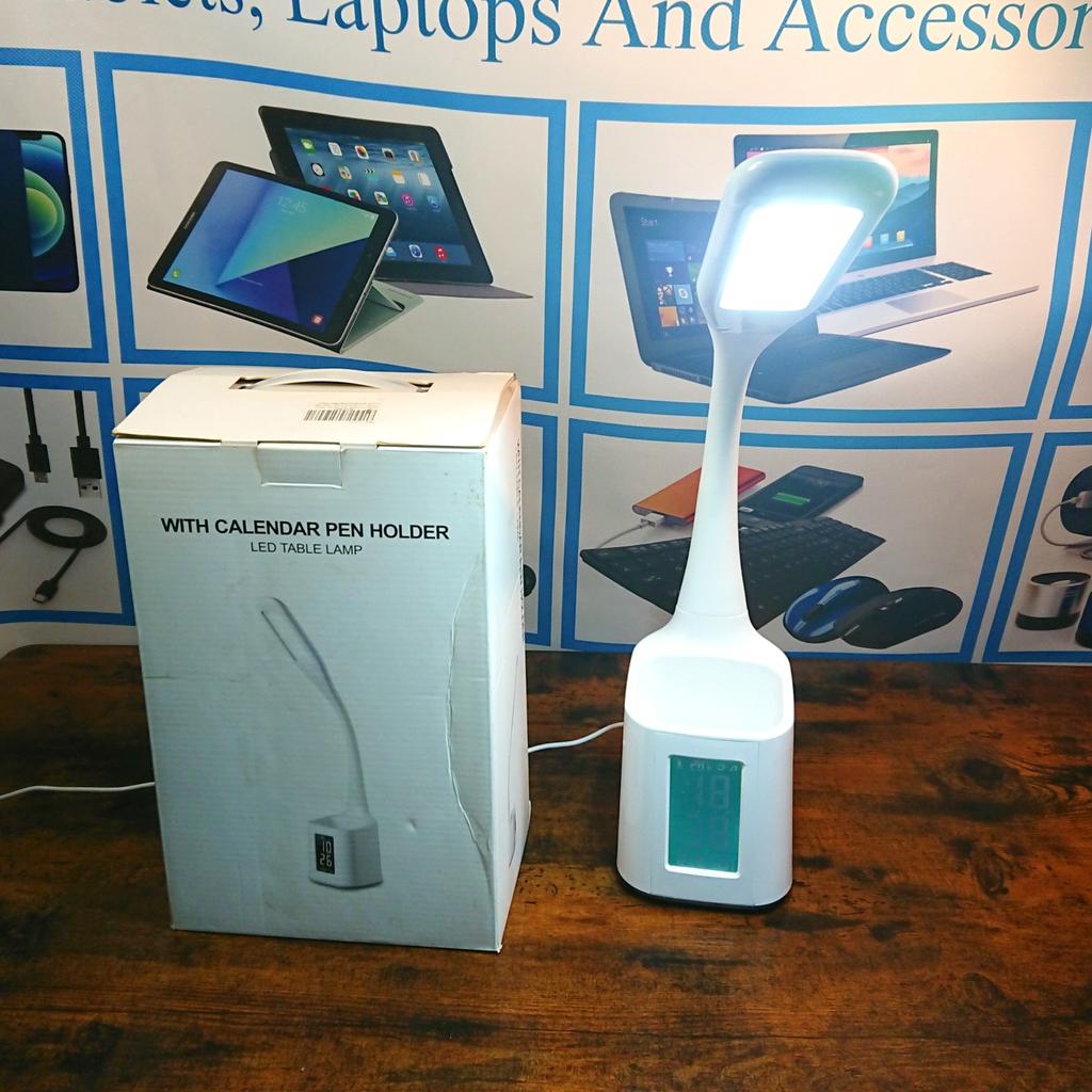 Brand new LED DESK LAMP with Touch Control eye protection lamp with USB Charging Port. Has dimmable Lamp with Pen Holder, Alarm, Clock, Temperature, Calender. Brand New. Boxed. Never used.