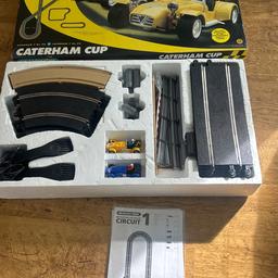 Scalextric Caterham Cup C1034
British 1/32 scale slot car brand
Caterham 7 98 vCaterham 7No 99
As new in box complete with instructions ,track and 2 cars one blue and one yellow .Full working order .