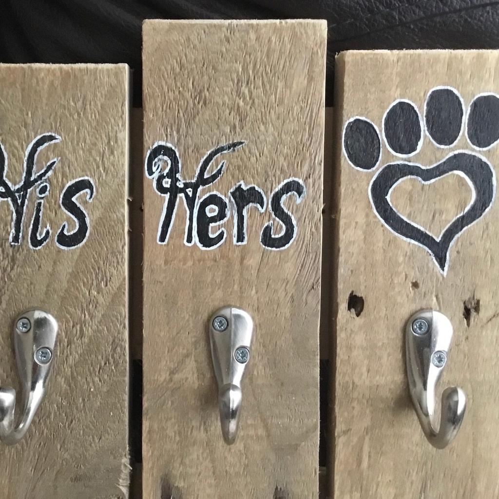 “His, Hers and Paws” Coat Hook and Pet Coats, Leads Hanger with 3 hooks, ideal for multiple coats and multiple leads also.

A stylish and eye catching storage solution for the humans of the house, ie your coats, hats, umbrellas etc and also your best friends coats, leads etc.

Cleverly created in a farmhouse style using reclaimed timber and therefore it has remnants left from its previous life ie, dents, nicks, nail holes, saw marks etc, will look stunning in any porch, hallway or cloakroom.

Measures approximately 16” high x 16” wide (overall).

Hand sanded and finished with a lustrous wax polish and with hand written signage.

Will grace any home and any decor or colour scheme and I’m betting it will be a very good talking point amongst family and friends.

Selling for just £17.00 or near offer

Cash on collection only.