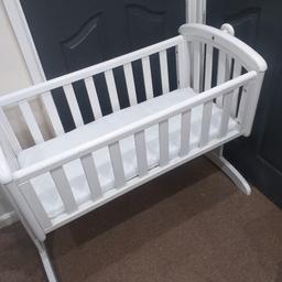 babys white type spindled swinging crib with mattress included in good condition. plus extras if wanted. 30 pound no offers collection only no transport. first to see will buy. reduced to sell grab a bargain. 25 pound.