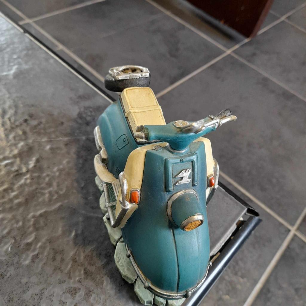 ■ PRICE: £25

■ CONDITION: GREAT - WITH FLAW
▪ Right handle bit broke off, but I still have the piece, so it can be repaired?

■ INFO:
▪ From Shudehill Giftware
▪ Of a vespa scooter
▪ Teal like colour
▪ Approx 4 inches x 5 inches x 3 inches
▪ Bought at least 13 years ago

■ IMPORTANT:
▪︎ Selling as moving house/downsizing
▪ Cash on collection [M34 5PZ] is preferred, but postage is also available

---

Tags: manchester Gorton Ashton Denton Openshaw Droylsden Audenshaw hyde tameside salford ancoats stockport bolton reddish oldham fallowfield trafford bury cheshire longsight worsley home decor decorative accent ornament decoration furnishing display ornament ornaments retro ornament scooter statue ornament retro scooter