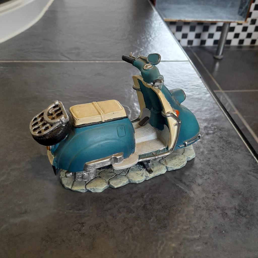 ■ PRICE: £25

■ CONDITION: GREAT - WITH FLAW
▪ Right handle bit broke off, but I still have the piece, so it can be repaired?

■ INFO:
▪ From Shudehill Giftware
▪ Of a vespa scooter
▪ Teal like colour
▪ Approx 4 inches x 5 inches x 3 inches
▪ Bought at least 13 years ago

■ IMPORTANT:
▪︎ Selling as moving house/downsizing
▪ Cash on collection [M34 5PZ] is preferred, but postage is also available

---

Tags: manchester Gorton Ashton Denton Openshaw Droylsden Audenshaw hyde tameside salford ancoats stockport bolton reddish oldham fallowfield trafford bury cheshire longsight worsley home decor decorative accent ornament decoration furnishing display ornament ornaments retro ornament scooter statue ornament retro scooter
