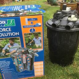 A Hozelock Cyprio Bioforce Revolution 14000 pond filter. This filter is pump fed, external pressurised and uvc unit which is suited for either above ground or in ground installed adjacent to the pond or concealed at the top of a waterfall. Easy to clean with revolving handle on top of the unit. It has unused Cypricube foam and bio-media. Full installation and operation instructions included