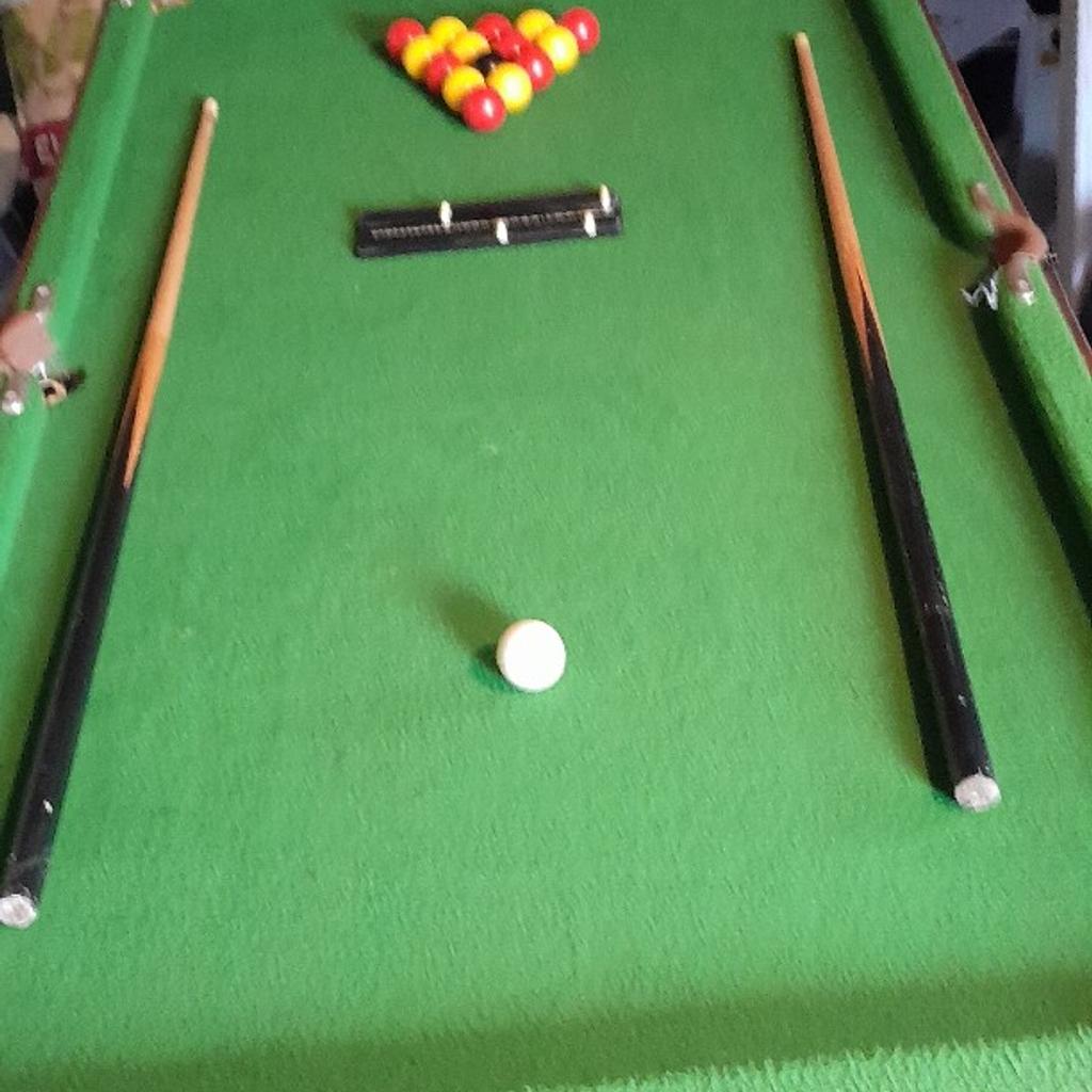snooker/pool table with table tennis top and bats and net