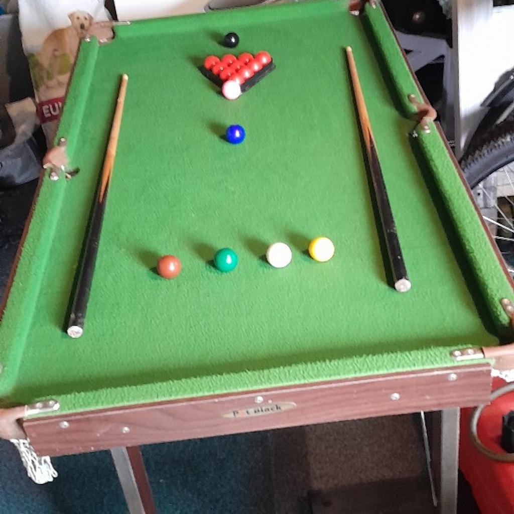 snooker/pool table with table tennis top and bats and net