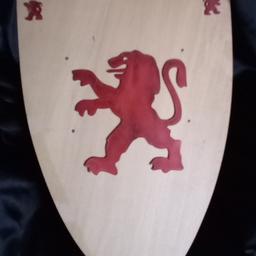 Wooden Shield with lion crest. Ideal for Halloween fancy dress outfit, to fight off the zombies & ghouls.

Measurements: 60x37x3 cm.

Top left hand lion a little bruised from battle scar, so just let you know.

Any low offers will be ignored or links being sent by scammers; naturally.Any low offers will be ignored or links being sent by scammers; naturally.

Local collection preferred from a safe spot, Tesco Express Tulketh Mill PR2 2BT. Protects both seller & buyer. Old school 'click & collect'