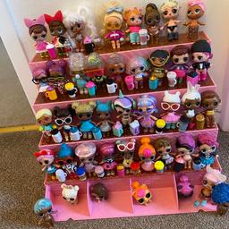 Large bundle of Lol Surprise dolls(38), water bottles and a few pets in excellent condition, sold as seen with stand.