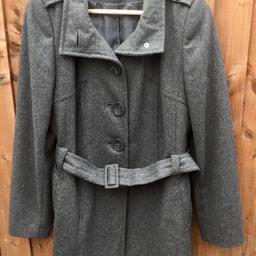 Hi,
A very nice coat,
Grey in colour,
5 button front fastening, it can be buttoned up to the neck,
1 button on each shoulder tab,
Belt & buckle,
2 side pocket,
Slit at the bottom of the back,
Fully lined,
Size 14
By Dorothy Perkins,
Excellent condition.
Postage £4.50
Thanks for looking.