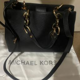 Michael Kors black handbag with gold chain detail. Used twice but In good condition- small faded mark on side of bag - not very visible but have included pic for reference