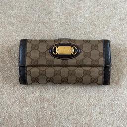 Genuine Gucci purse button closure several compartments for cards and notes.

Used - signs of wear please refer to photos. Also Tarnishing on the Gucci metal buckle on front and green highlighter mark on side of purse.

Approx measurement’s: 
Width 7.5 inches 
Height 4 inches