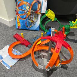 Hot Wheels Track Spin Storm. 
The Car is missing and two small grey support pillars. It does turn on and the wheel spins. 
There is a dragon track as well but not sure about that if it works