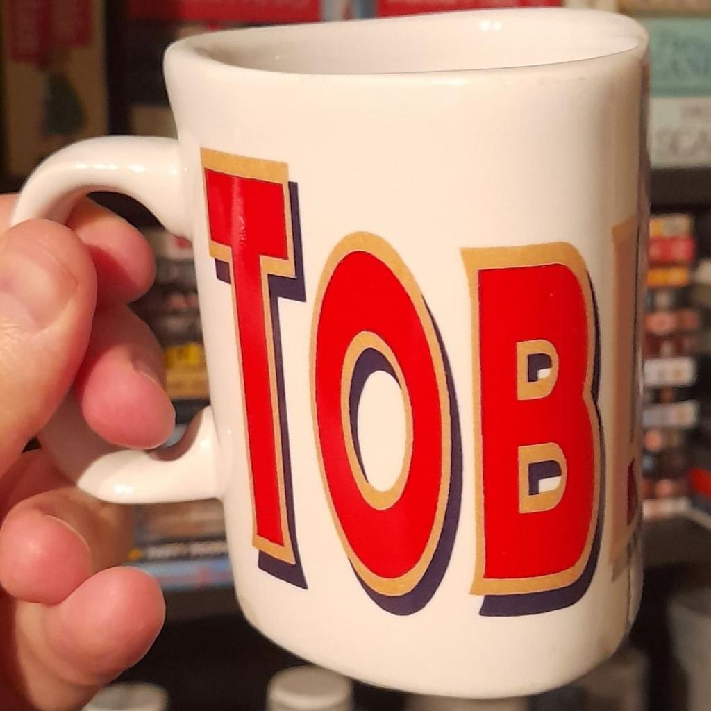■ PRICE: £12

■ CONDITION: GREAT - USED
▪ Minor marks

■ INFO:
▪ Only for ornament purposes only
▪ Has the classic 'Toblerone' logo across the exterior
▪ Mug is kind of shaped like a piece of Toblerone, triangular
▪ Unsure of when it is from. Late 90s or early 00s would be my guess

■ IMPORTANT:
▪ Extra pictures are always available
▪ Selling as selling house/downsizing
▪ Cash on collection only = M34 5PZ [Manchester]

---

Tags: manchester Gorton Ashton Denton Openshaw Droylsden Audenshaw hyde tameside north west salford ancoats stockport bolton reddish oldham fallowfield trafford bury cheshire longsight worsley vintage mug retro mug cup cups mugs drinkware coffee mug tea mug chocolate collectible mug collectors novelty mug kitchen drink ceramic mug prism 1990s glassware