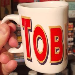 ■ PRICE: £12

■ CONDITION: GREAT - USED
▪ Minor marks

■ INFO:
▪ Only for ornament purposes only
▪ Has the classic 'Toblerone' logo across the exterior
▪ Mug is kind of shaped like a piece of Toblerone, triangular
▪ Unsure of when it is from. Late 90s or early 00s would be my guess

■ IMPORTANT:
▪ Extra pictures are always available
▪ Selling as selling house/downsizing
▪ Cash on collection only = M34 5PZ [Manchester]

---

Tags: manchester Gorton Ashton Denton Openshaw Droylsden Audenshaw hyde tameside north west salford ancoats stockport bolton reddish oldham fallowfield trafford bury cheshire longsight worsley vintage mug retro mug cup cups mugs drinkware coffee mug tea mug chocolate collectible mug collectors novelty mug kitchen drink ceramic mug prism 1990s glassware