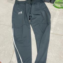Grey under armour bottoms straight leg zip up pockets worn once son didn’t like fit so basically new as took off after about half hour