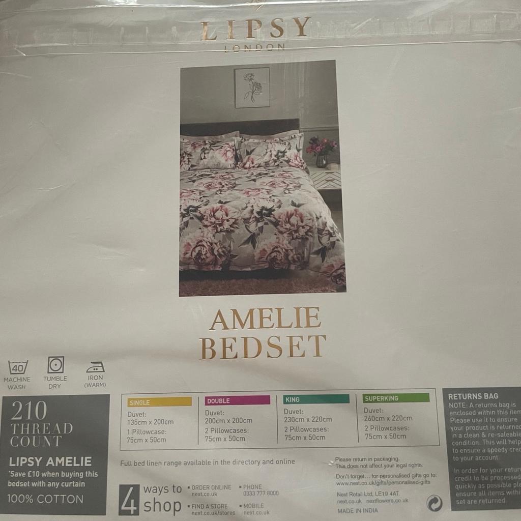 New in packaging, grey with pink flower print, king size duvet set. No offers