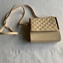 Atmosphere Cream  and gold mini handbag
6” x 5” x1.5”
Strap length inc gold chain 49”
Great condition
