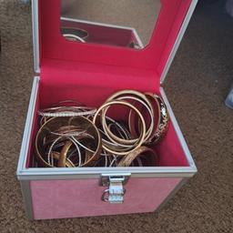 pink vanity case full of bangles 
collection wednesbury