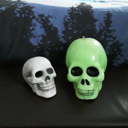 Selling 2  Skulls,Large Neon Green one is Huge, a Heavy Candle ,Smaller one you can use Tea Lights,Both Great Condition from smoke and pet free home, Both for £5 REDUCED.ABSOLUTE BARGAIN.