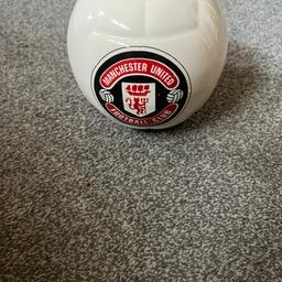 Manchester United ceramic money box in excellent condition. Cash on collection.