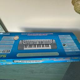 Casio Song Bank Keyboard in box complete with music information system and hands free microphone for singing performances .Highly functional portable compact keyboard battery operated .Can use with 7.5 volt mains adaptor not supplied .  Like new in box complete with instructions and song book