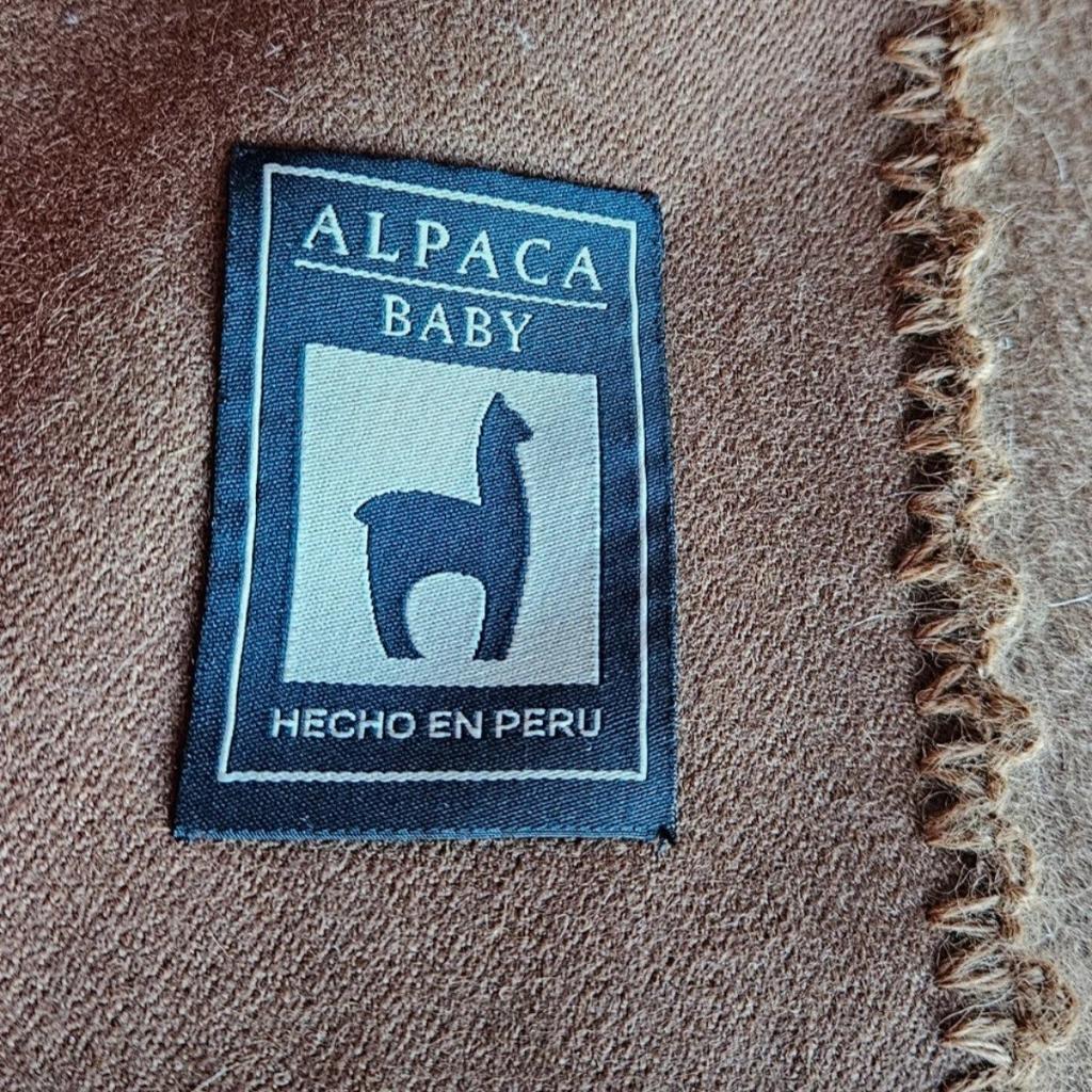 Beautiful, soft 100% Baby Alpaca wool Poncho was hand crafted in Peru .
Baby alpaca is the first shearing when they're about 6-9 months old and is considered softer and more luxurious than cashmere.
Alpaca clothes are known for being extremely warm, lightweight, and soft; what is often forgotten is that alpaca clothing is durable, comfortable, and adaptable to every season.
This was made with traditional techniques and is on a very high standard.
Very rare item.
Dimensions: 53 inches wide x 39 inches long.
Opening front with 2 layers .
Hand wash or dry use mild detergent ,do not bleach.
Reasonable offer accepted.
I tiny sign of wear, barely visible,see pictures, please, before purchasing.
I answer any questions you may have.