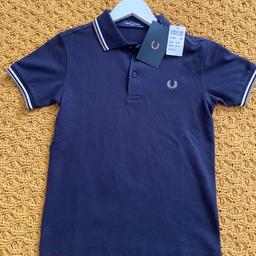 Kids polo neck T-shirt brand-new . with tags  size age 9 to 10 bought the wrong size