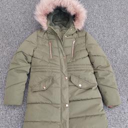 Khaki coloured winter coat
Double zips
fur lined
Hood and pockets 
Age 10-11 Years
Excellent condition, hardly been worn.