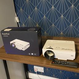 Mini projector, used once. Comes with box, remote, power cable and AV cable. Can post for an additional fee.