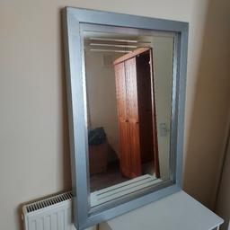 it's a heavy mirror with a few marks and scratches, nothing a respray or coat of paint wouldn't sort out.