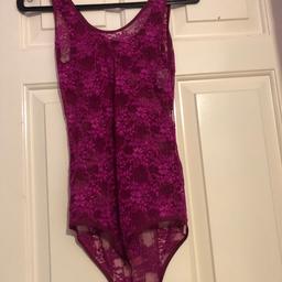 Lovely body top colour is cherry . New with tag  look at other items selling Womens  boys clothes etc.,combine postage. Lots of top shop jeans Jamie etc