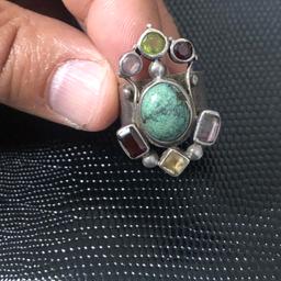 Old vintage silver ring with multi natural genuine stones as turquoise,ruby,purple amethyst, garnet yellow sapphire, very solid , stamped outside. Pls look at the pictures attached for more details. Can accept PayPal,collection, bank transfer or delivery if close by . Shpocks wallet too
