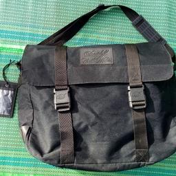 Davidoff Black Canvas Messenger bag from Cool Water promotion.  Made of robust canvas, with bottom with rugged rubber mounts to protect it from wear. 

Would make an everyday item or use it from travel as a carry on, as strong shoulder strap as well as secure clips.

Approximately 60X40X20cm