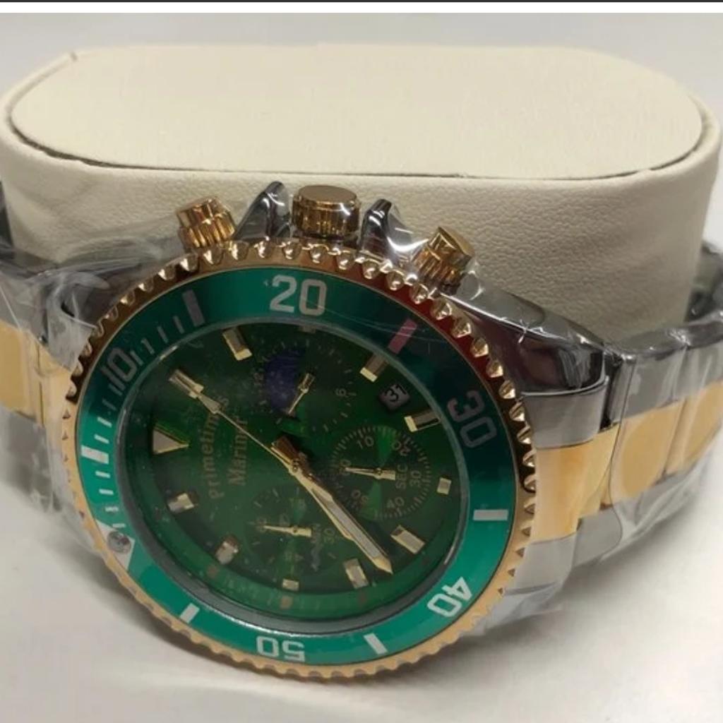 PRIMETIMES MARINER, MODEL PT1967. MEN'S GREEN FACE AND GREEN/GOLD BEZEL SPORTS WATCH WITH QUARTZ MOVEMENTS, STAINLESS STEEL /GOLD STRAP, 43MM DIAL, WATERPROOF TO 30 METERS.