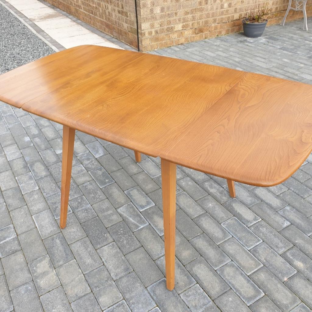 A lovely blonde Ercol Windsor drop leaf dining table having the early blue label and in good condition. Possible delivery at a cost depending where you are.