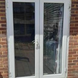 white uPVC French doors 
dimensions W149cm x H205cm
with 3 keys
removed carefully 
collection from Slough SL1.