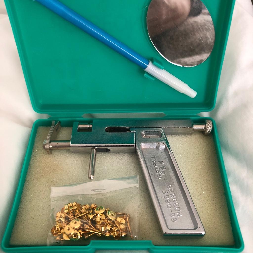 Brand new ear piercing gun with studs new as well