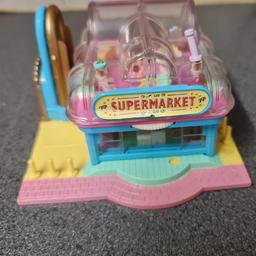 Rare vintage bluebird polly pocket supermarket, light up supermarket.The supermarket has two floors and a wheel for opening the supermarket doors, which is still working.