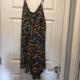 Lovely summer dress or could be worn with a black jacket and long boots. Looks like new worn a few times