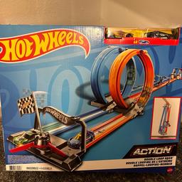 Contents: 1x Hot Wheels Double Loop Dash Track Set & 2x Diecast Toy Cars
Dimensions: 182.9L x 20.3W x 25.4H cm
Ultimate side-by-side racing experience
Kids can race solo or with their friends
3.65 metres of track and double loop!

The Hot Wheels Double Loop Dash is the longest-ever side-by-side drag racetrack! Kids can race their Hot Wheels cars down the racing track, around the loop and over the finish line in this versatile playset!

Build Your Hot Wheels Track 
Kids can assemble this Hot Wheels set to an extra-long race car track for the single-player mode. They can also race their friends and compete to find out who the fastest racer is!

Fun-Filled Racing Set 
This action-packed Hot Wheels set features 3.65m of track and comes with 2 Hot Wheels diecast vehicles. Folds up quickly for on-the-go fun and convenient storage.
