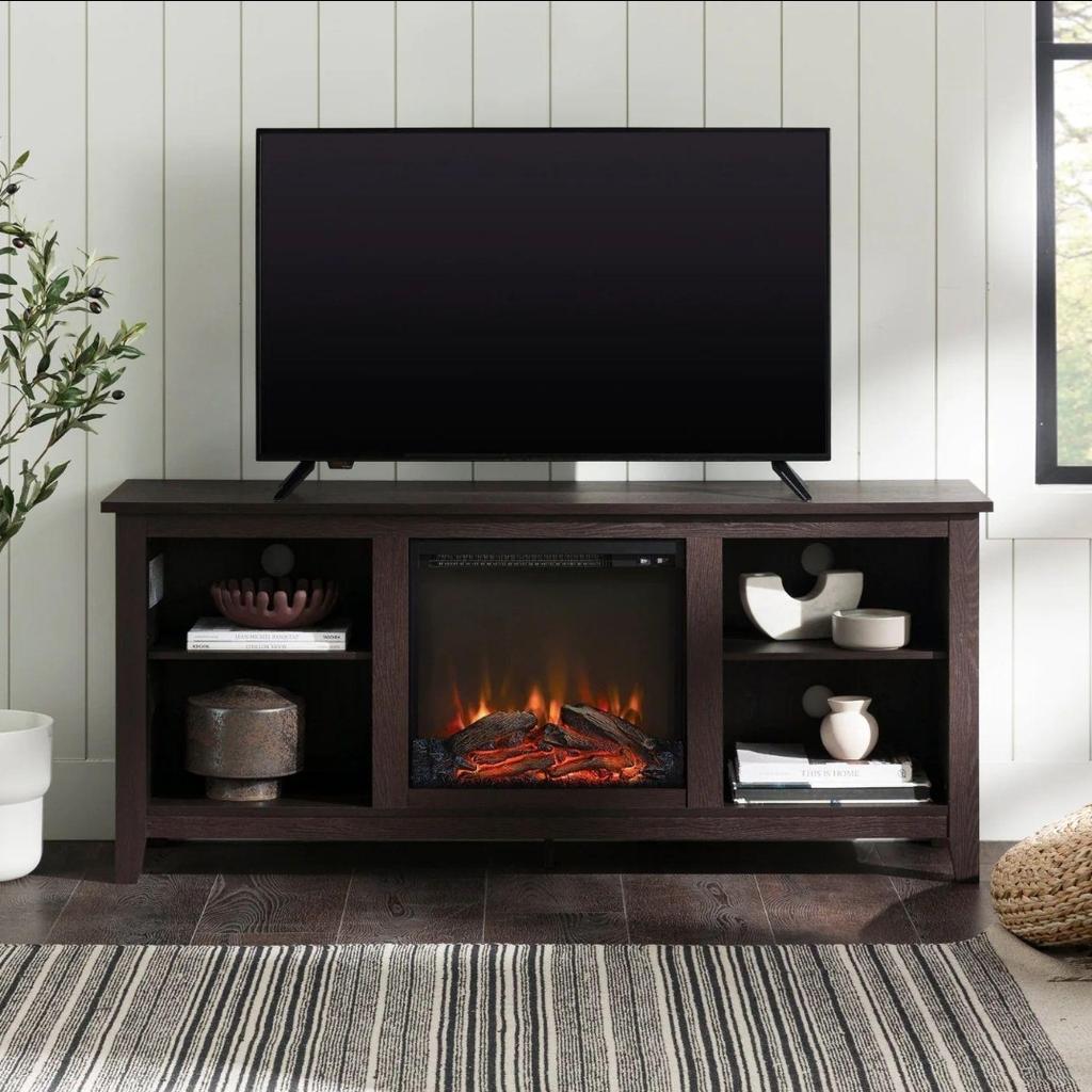Display your TV in style with this 58-inch TV stand and electric fireplace. Crafted from high-grade MDF with a durable laminate finish for a rich, textured surface, this storage console features two adjustable shelves on both sides of the fireplace for anything from your electronics to your home décor. With a cord management port at the back of each shelving space, you’ll never have to worry about a tangled mess of wires as it’ll keep them organized. This entertainment center mixes a traditional style with the on trend rustic farmhouse look with its simple design and will be a classic piece to your living room.