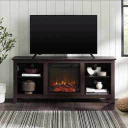 Display your TV in style with this 58-inch TV stand and electric fireplace. Crafted from high-grade MDF with a durable laminate finish for a rich, textured surface, this storage console features two adjustable shelves on both sides of the fireplace for anything from your electronics to your home décor. With a cord management port at the back of each shelving space, you’ll never have to worry about a tangled mess of wires as it’ll keep them organized. This entertainment center mixes a traditional style with the on trend rustic farmhouse look with its simple design and will be a classic piece to your living room.