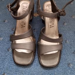 Size 3, grey, Modernissima sandels. 2 inch block heels. Leather. Made in Italy. Never been worn.
Only slight defect is that I made extra holes for tighter fit, with intention to wear, but never did wear them. Please see photo.

**PLEASE NOTE – CASH ONLY AT THE POINT OF SALE (LOCALLY) IN PUBLIC PLACE OR DOOR PICK. NO REFUNDS. NO ARRANGEMENT OF COURIERS. NO TIME WASTERS PLEASE. 