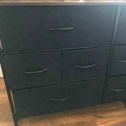 fabric drawers, wooden top, and steel frame. used for a year and in good condition.