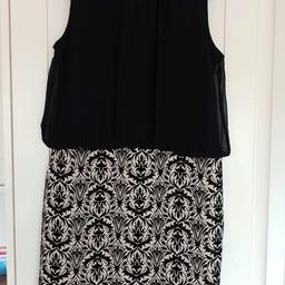 dress with black top and patterned skirt