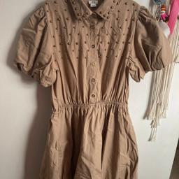 #Girls trendy #riverisland puff ball #dress with stud detailing 

Size: 12 years 
Colour: Tan 

Condition: in very good #likenew condition.  Worn 2-3 times and still looks great! No flaws or imperfections