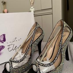 Black shoes with lots of sparkly jewels.by designer Lunar Elegance.padded insole.heel height 4 inches.none slip rubber sole.size 3.Been £60.00