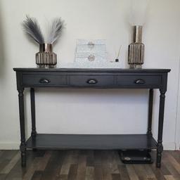 Brand new console table only
Grey In Colour
Made From Wood
Three Drawers
Large
Don't go small when adding to your home interior, introducing this excellent French Style Grey Wooden Console Table Large from our collection of French Furniture. A perfect addition to add to any room in your home. Finished in a lovely dark grey colour and with three spacious drawers for all your storage.

Height: 81cm
Width: 120cm
Depth: 35cm
(accessories not included)
Open to offers